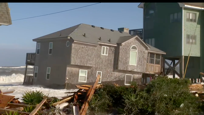 Home floats in ocean in Buxton, North Carolina on Oct. 2, 2025 after collapsing.
